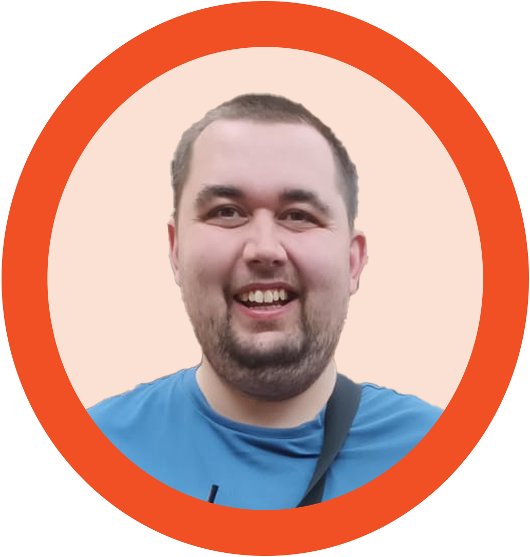 A young man smiling in an orange circle