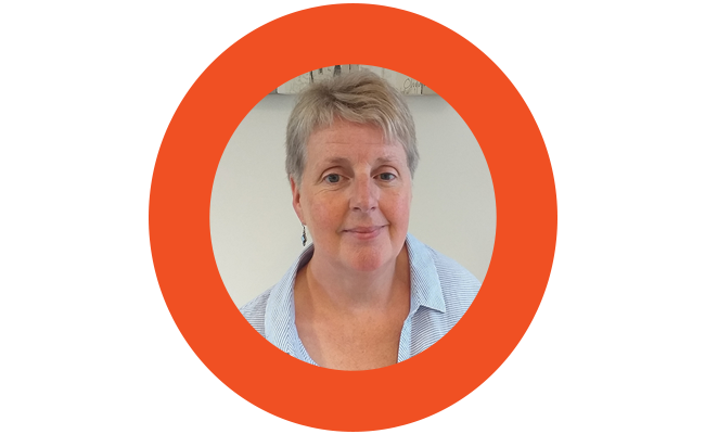 A photo of Karyn in an orange circle