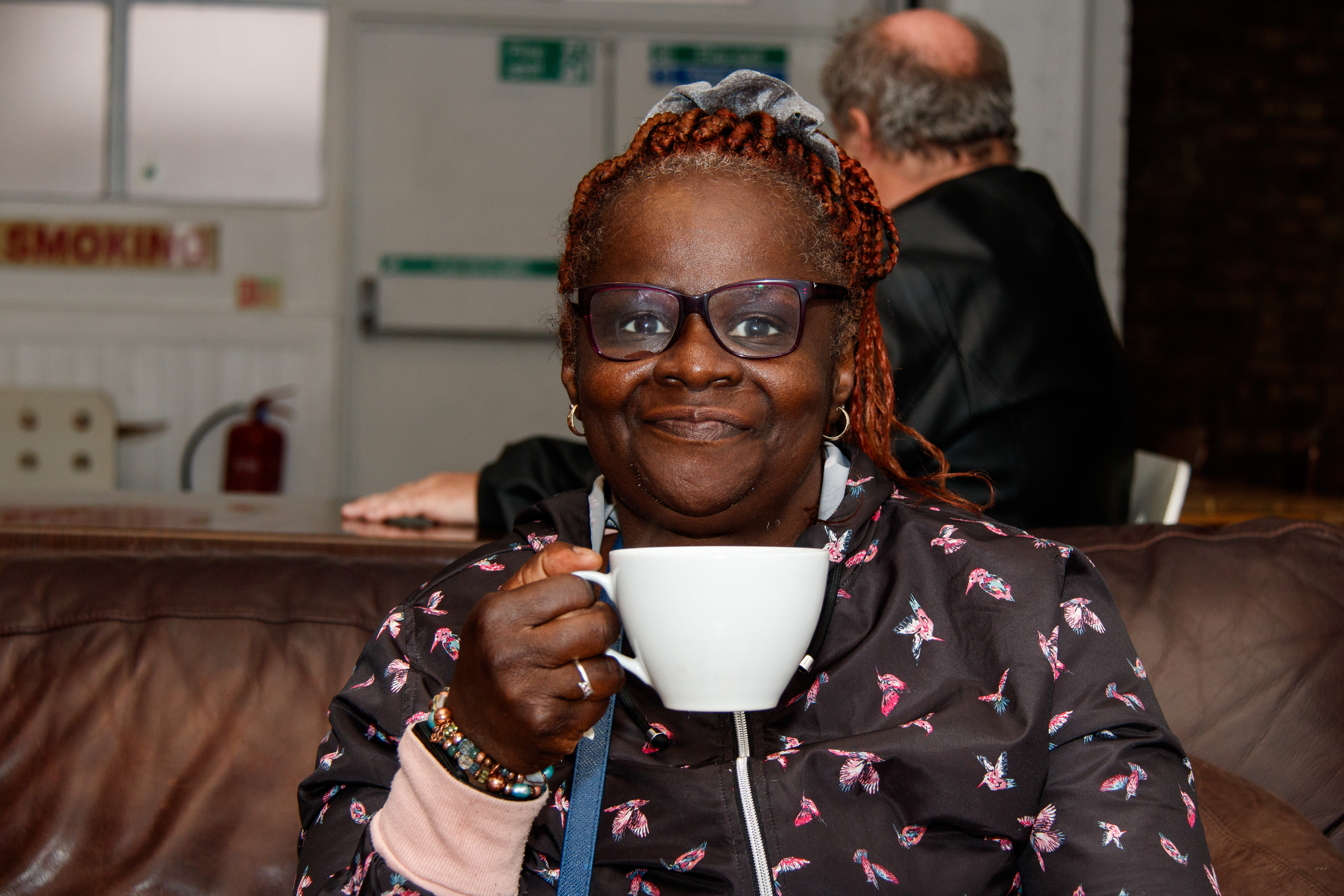 Southwark Member Lara drinking a cup of coffee
